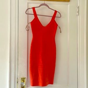 Herve Leger bandage dress in coral.